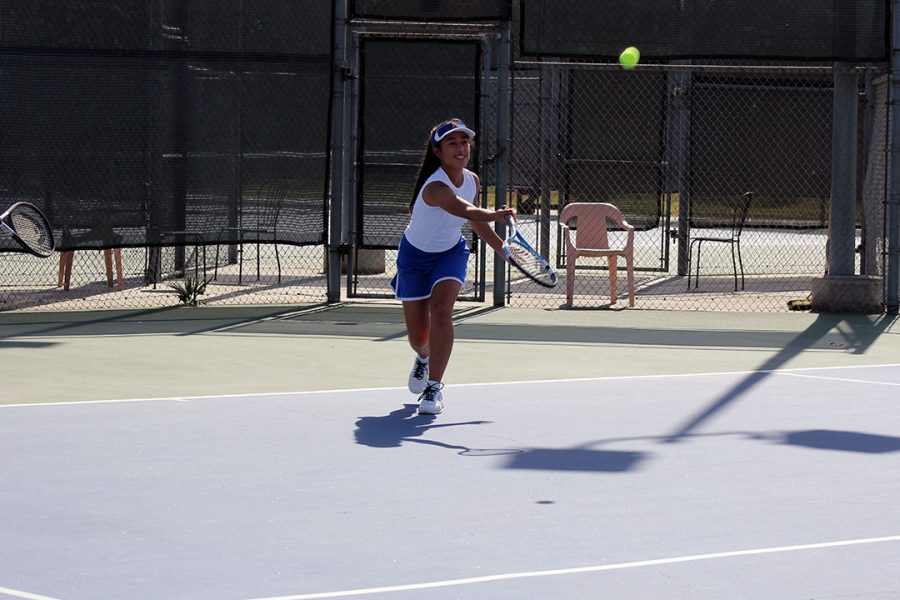 Cat Venegas returns the forehand. 