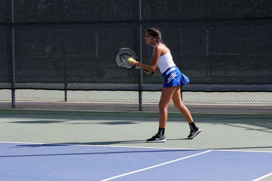 Annaliesse Galaviz  prepares to serve.