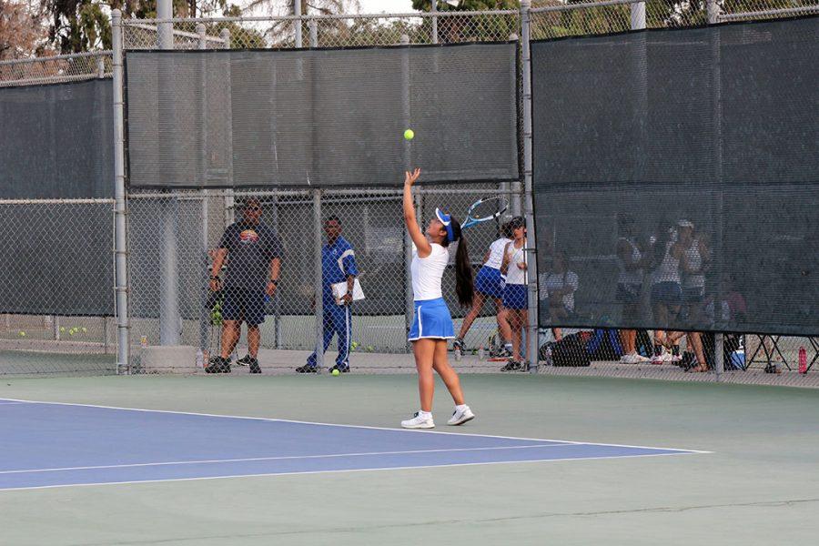 Cat Venegas getting ready to serve. 