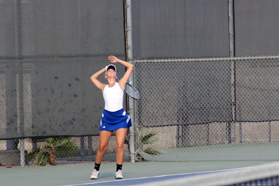 Natalie Lodolo serves the ball.