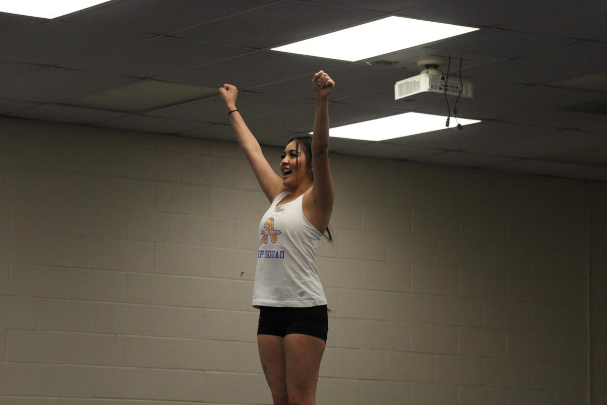 Senior Grace Tran poses at the top of a stunt during practice. Stunt is now an official CIF sport and Tran is one of the members on the team.